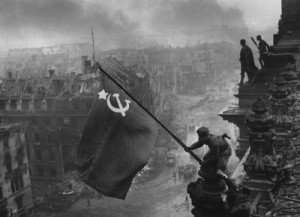 Berlin WWII - Raising a flag over the Reichstag - Picture courtesy of Wikipedia