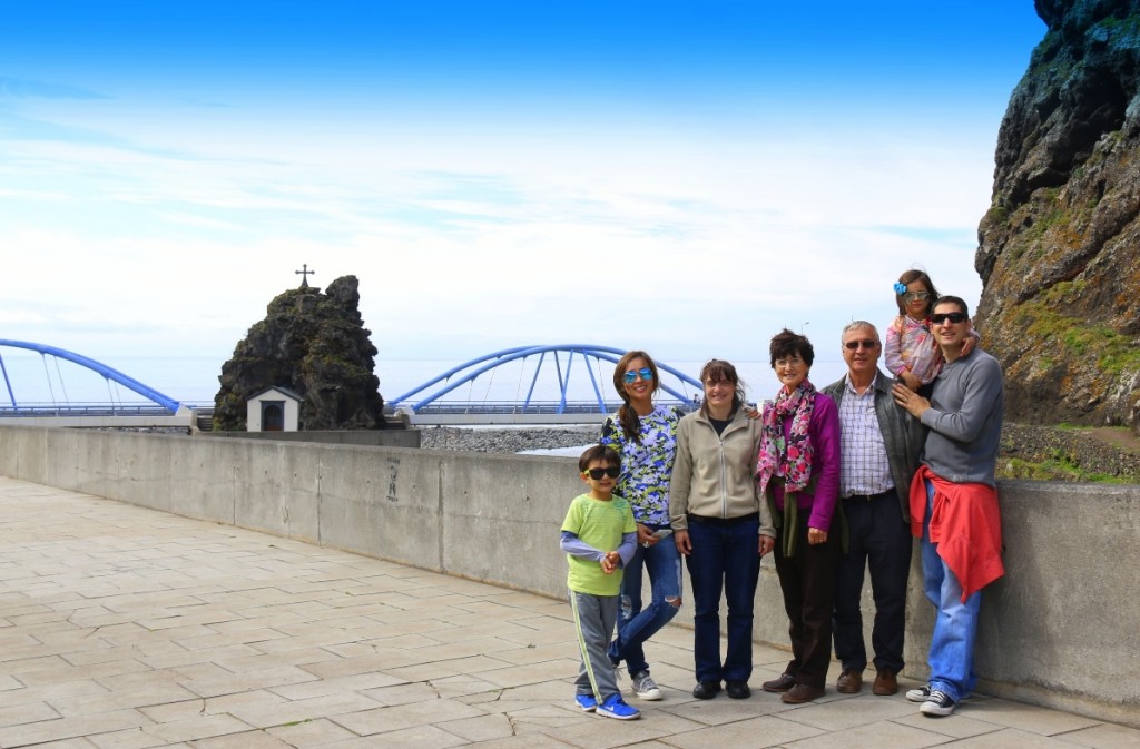 Teixeira family - background view is the Sao Vicente chapel by the bridge